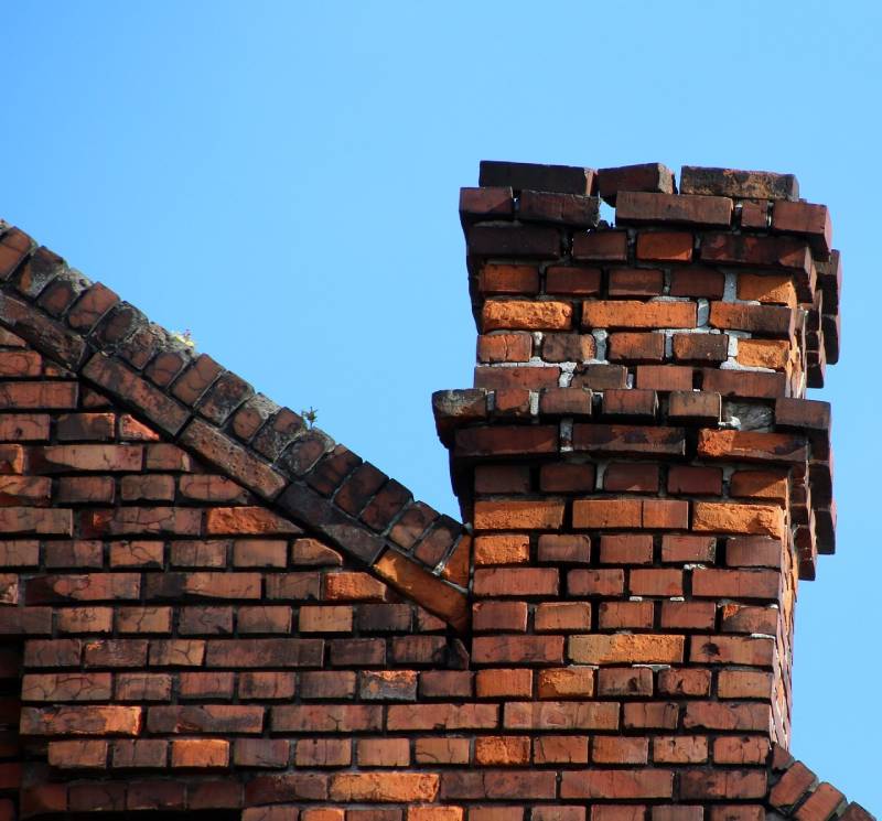 Signs Your Harvey Home Needs a Chimney Inspection Damaged chimney on an Harvey home showing cracks and missing mortar